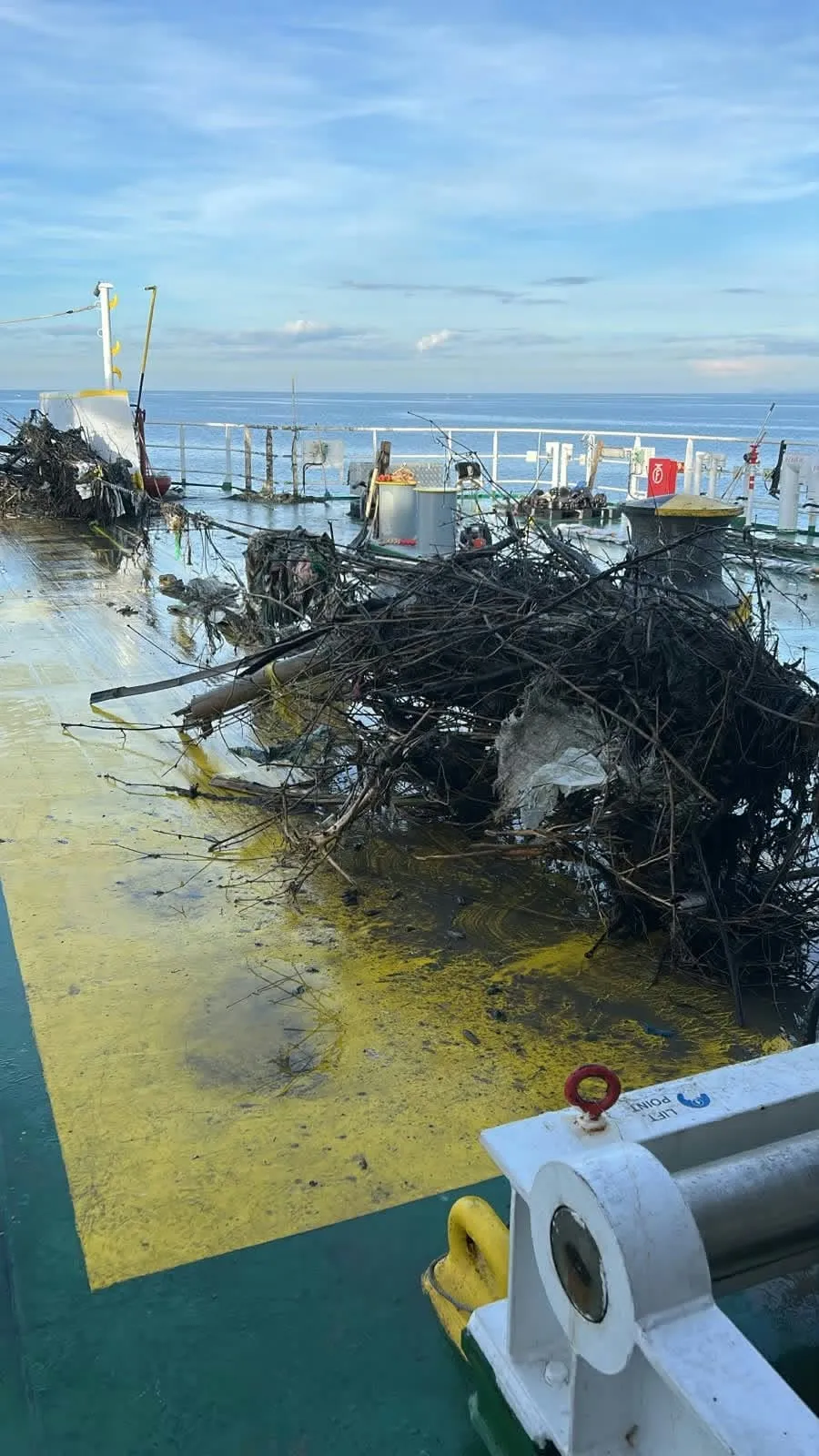 Submarine cable recovery: debris piled on deck after the cable came up
