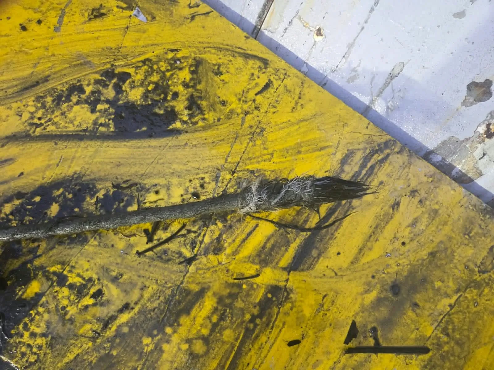 Submarine cable recovery: damaged cable sheathing on deck
