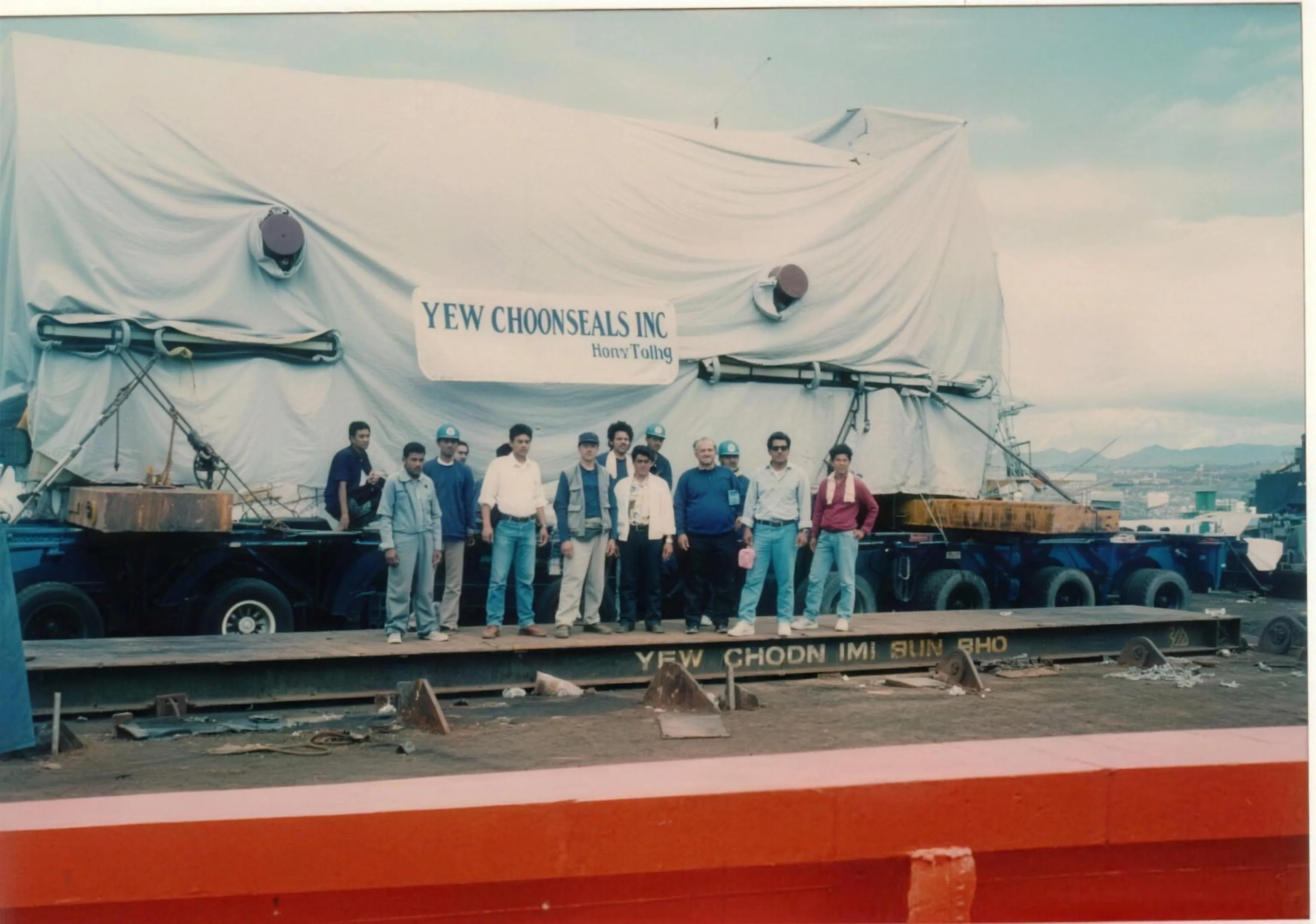Crew and cargo team with a 500-ton GE power generator on deck before discharge